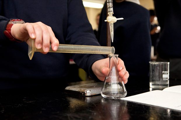 Student performing a chemistry experiment