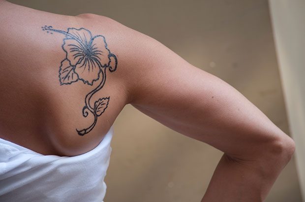 Image of a female tattooed.