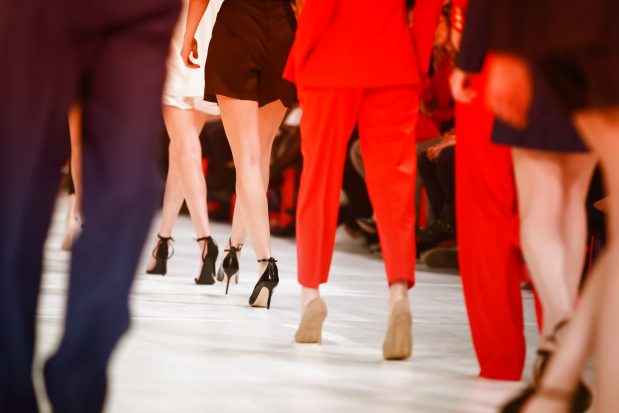 Models walking down runway