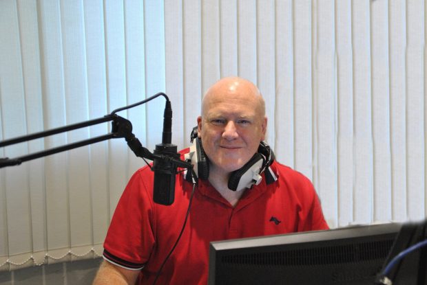 Daren Green on his community radio microphone during COVID-19