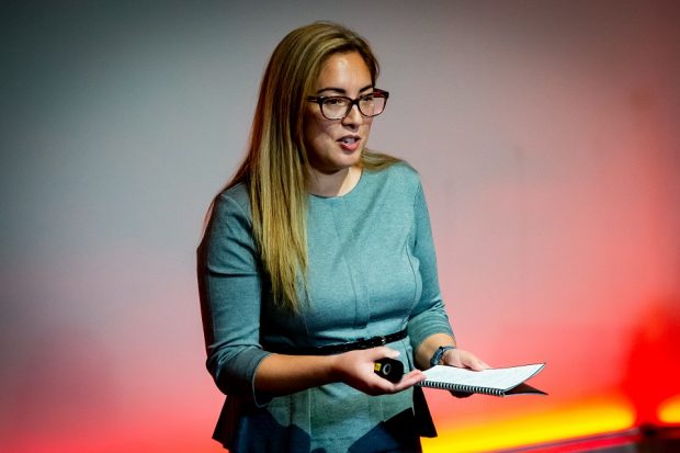 Lizzie Anderson standing up delivering a speech