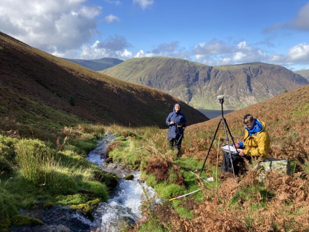 Sometimes the sun even shines while we’re out surveying! Surveyors out in the Lake District