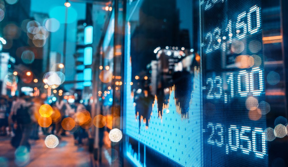 Stock market quotes over out of focus City scene