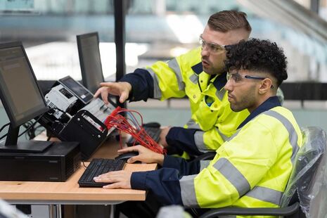 An apprentice working with his supervisor