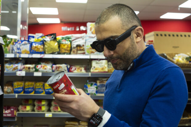 Mavis Technology CEO and founder David Sikharulidze demonstrating how his smart glasses help him to navigate the world around him. and support him with food shopping.