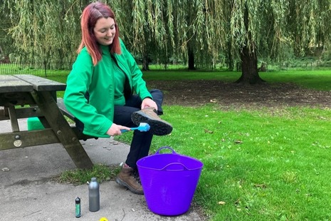 Biosecurity boot cleaning.
