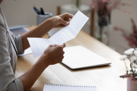 A person reading a letter