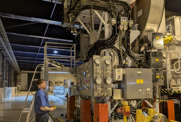 Nuclear operator operating the resuspension equipment in the flocculant storage tanks.