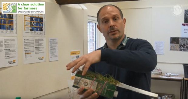 Natural England soils expert demonstrating a soils experiment
