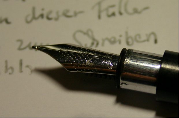 A fountain pen and paper to show briefing writing