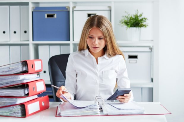 business woman studying some paperwork