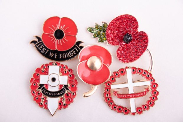 A collection of counterfeit poppy broaches