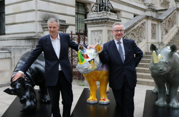 Zac Goldsmith MP and the Environment Secretary, Michael Gove standing next to the Tusk Trust statues in Westminster.