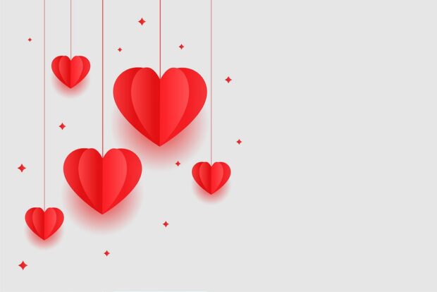 A white background with red hanging origami love hearts