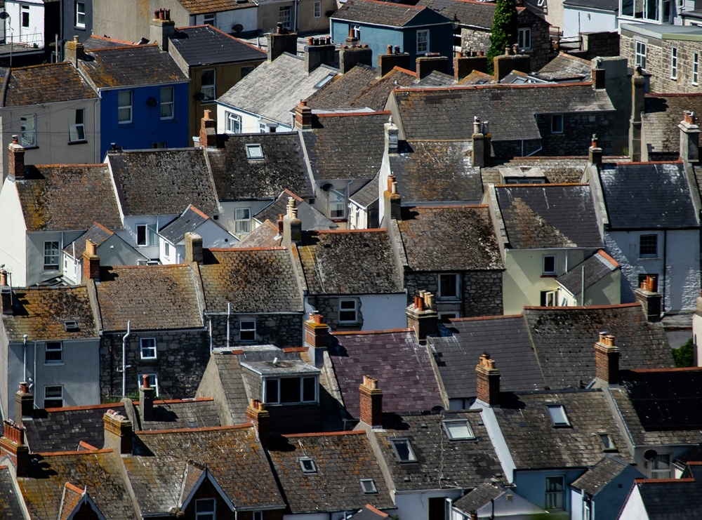 Aerial view of houses and rooftops. Credit: Pete F, Unsplash