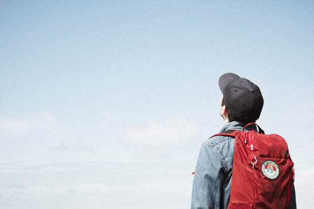 Student looking up at the blue sky