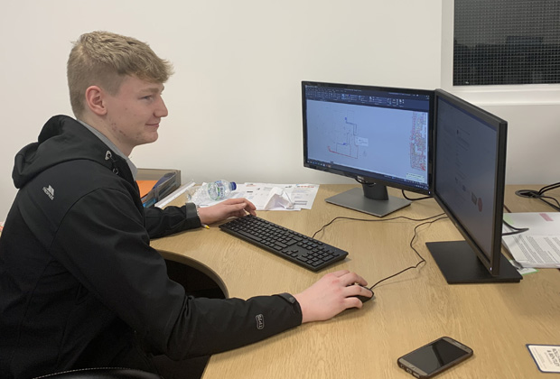 Archie Lamb from SJD Electrical at a computer