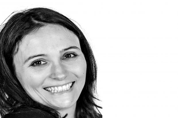 Francesca looking into the camera on a white background