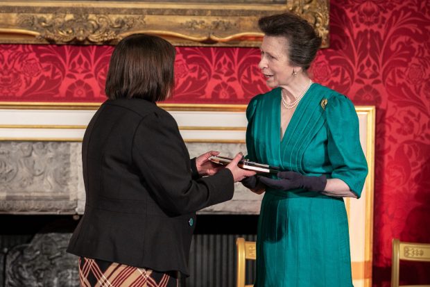 Deborah Nicholas being presented with a Princess Training award by Princess Anne