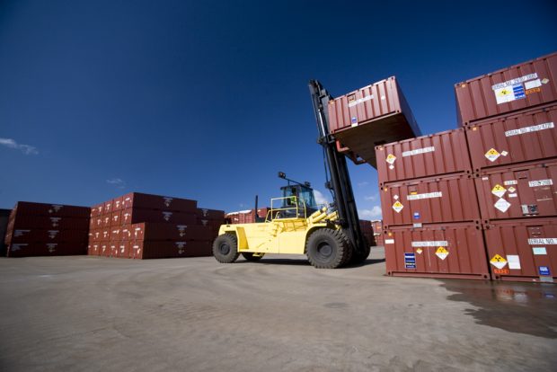 A forklift truck lifting a container at the Low Level Waste Repository