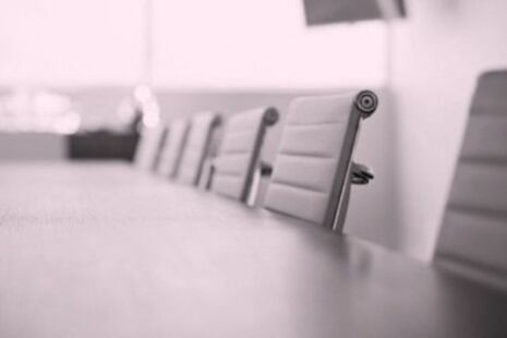 Meeting room table and chairs set up for an advisory committee meeting.