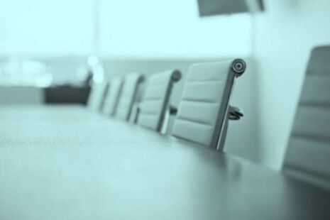 Meeting room table and chairs set up for an advisory committee meeting.
