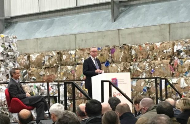 The Environment Secretary speaking on a stage at the Waste to Wealth Summit.