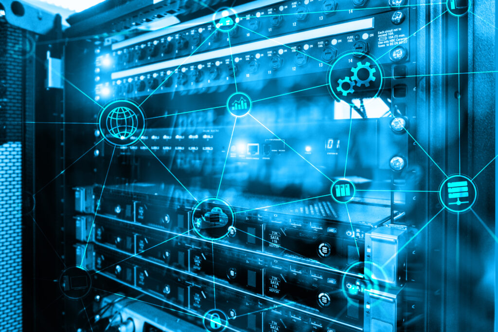 A close-up view of server racks and network hardware with glowing digital icons overlaid, representing data, connectivity, cloud computing and technology systems.