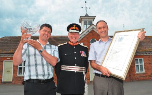Gtech’s design engineer Andy Kent and technical manager Andrew Boddy with Lord Lieutenant Colonel Patrick Holcroft.
