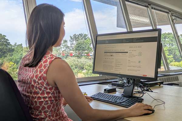 A visitor sat at a computer, using the online catalogue at The National Archives.