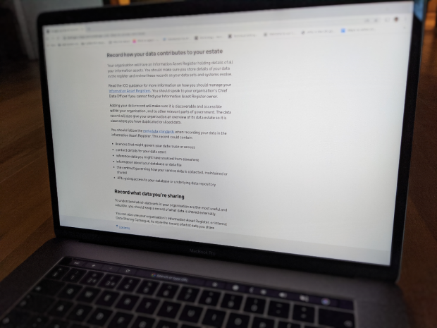 Image of a laptop screen showing the 'Record how your data contributes to your estate' guidance page on GOV.UK
