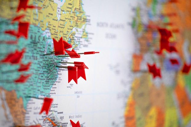 A map with pins in locations across the USA and Europe.