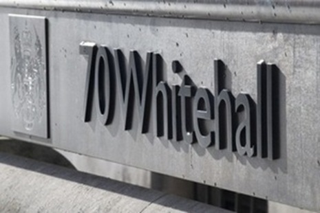The address plate of the 70 Whitehall building, showing the crest, number and street name.