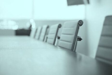Meeting room table and chairs set up for an advisory committee meeting.