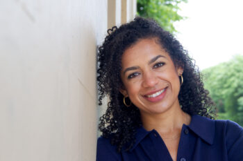 A woman smiling into the camera