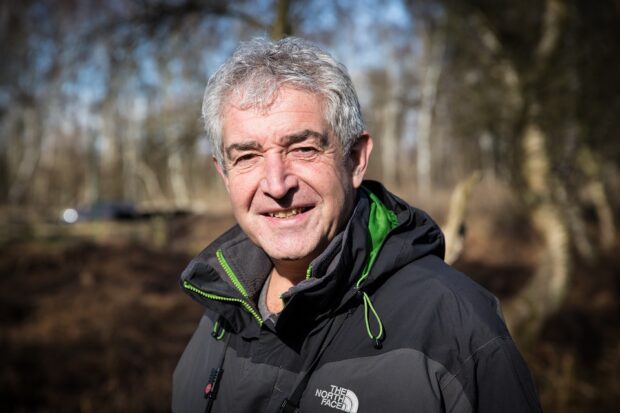 Portrait image of Tony Juniper in a woodland