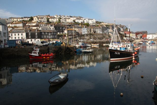 Landscape view of a harbour with moored fishing boats