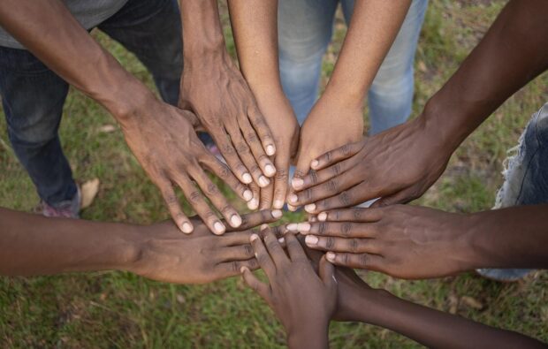 Overlapping hands in spirit of unity