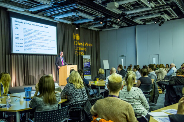Phil Busby on stage giving a presentation at the RLDC