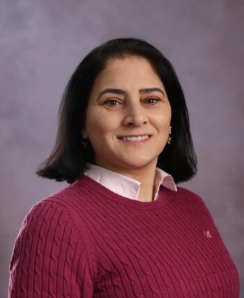 A woman smiling at the camera