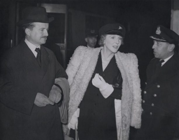A photo of Alfred Duff and Lady Diana Cooper talking to a VIP.