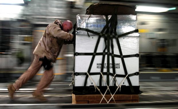 Man pushing cargo.