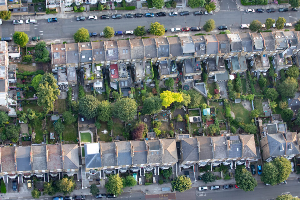 Image of rooftops on a UK street.