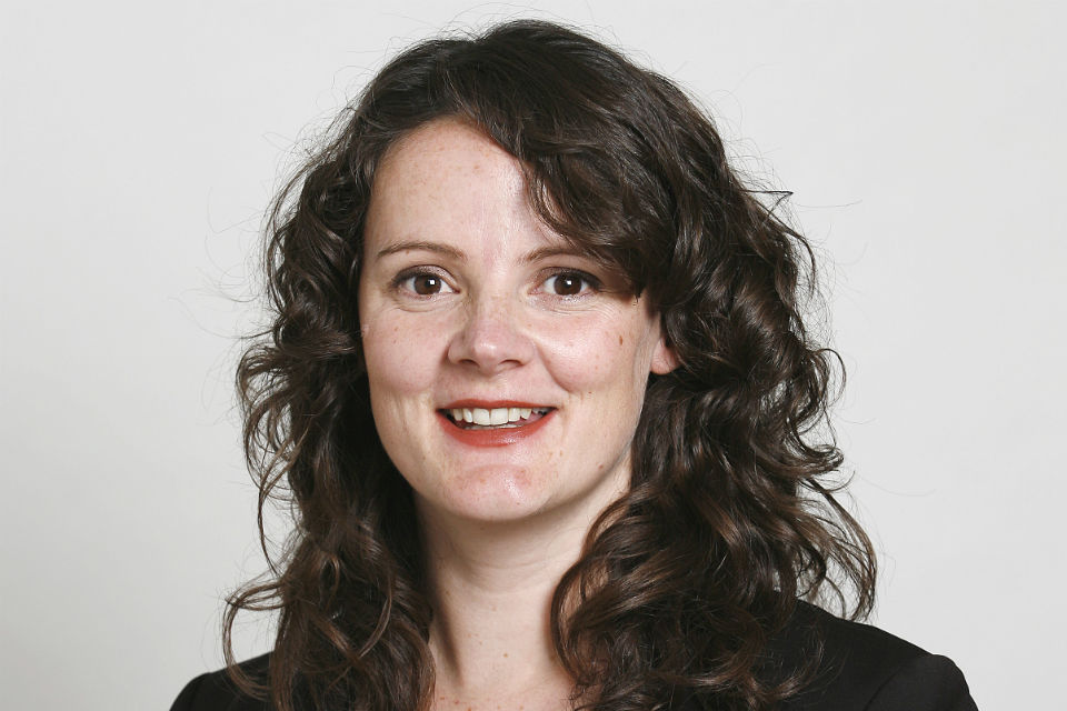 Head and shoulder of woman with long dark hair