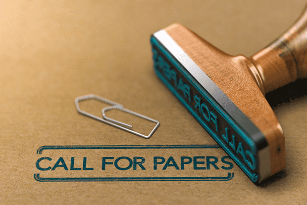 The phrase Call for Papers stamped on paper by a rubber stamp