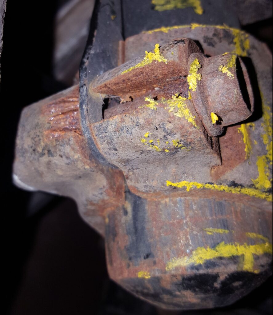 A badly corroded shock absorber