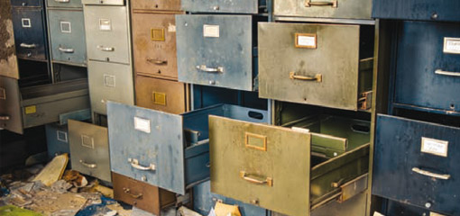 old filing cabinets with open, empty, drawers