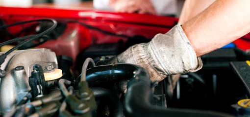mechanic working on an engine