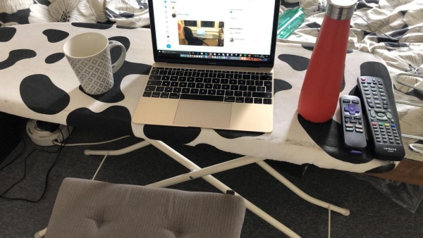 Ironing board being used as a desk
