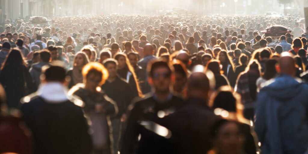 Crowd of people walking along a street, used to illustrate the Poverty in Data event hosted by the UK Data Service.